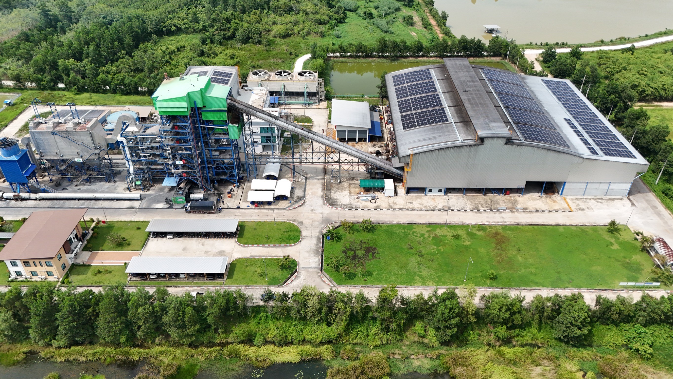 Drone photograph showing the complete boiler, from green roof to blue steel base